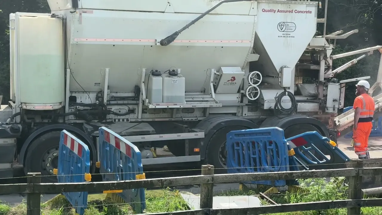 Procon 24/7 volumetric mixer set up at the kerb beside a coned trench, foam tank visible on the chassis