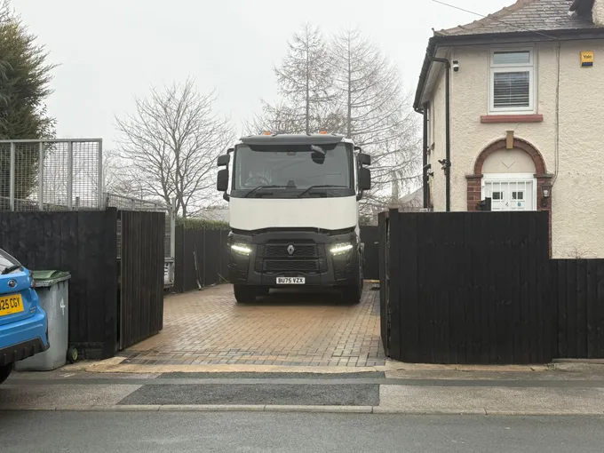 Procon mixer reversed into a domestic driveway between fences